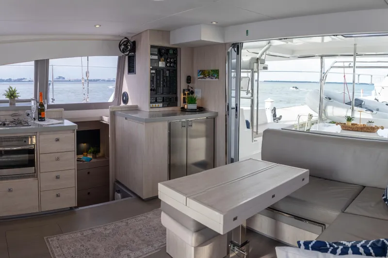 Everything Zen Yacht Photos Pics Interior of 2017 Leopard 40 catamaran with modern kitchen and ocean view.
