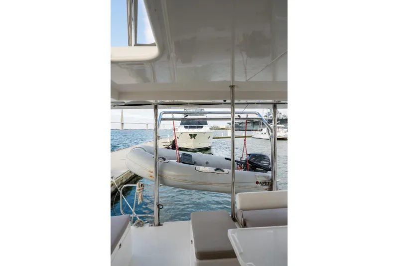 Everything Zen Yacht Photos Pics 2017 Leopard 40 catamaran with dinghy and Yamaha motor at marina.