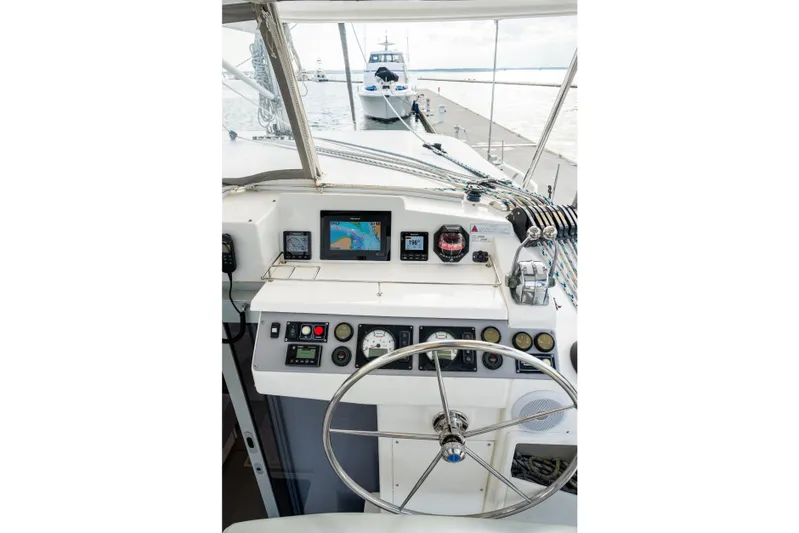 Everything Zen Yacht Photos Pics Cockpit view of 2017 Leopard 40 catamaran with navigation instruments and steering wheel.