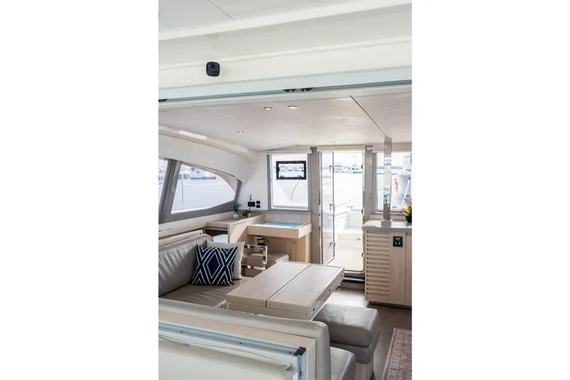 Everything Zen Yacht Photos Pics Interior of 2017 Leopard 40 catamaran, featuring modern seating and large windows.