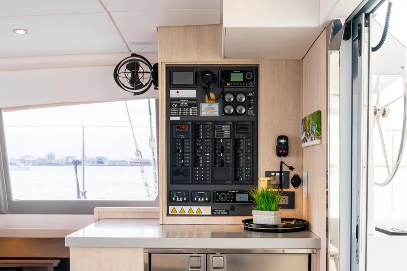 Everything Zen Yacht Photos Pics Control panel inside a 2017 Leopard 40 catamaran, featuring navigation and electrical systems.
