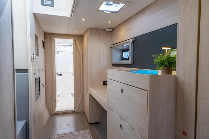 Everything Zen Yacht Photos Pics Interior of 2017 Leopard 40 yacht, featuring modern wood finish and compact design.