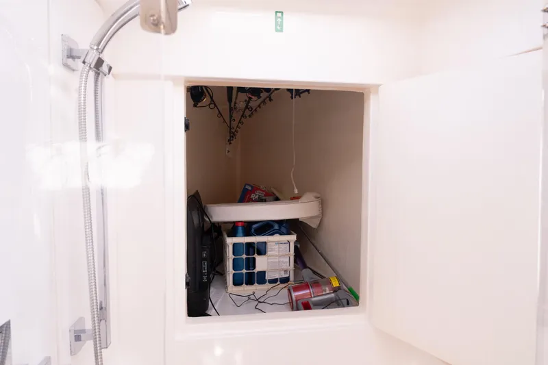 Everything Zen Yacht Photos Pics Storage compartment in a 2017 Leopard 40 yacht, featuring various equipment and supplies.