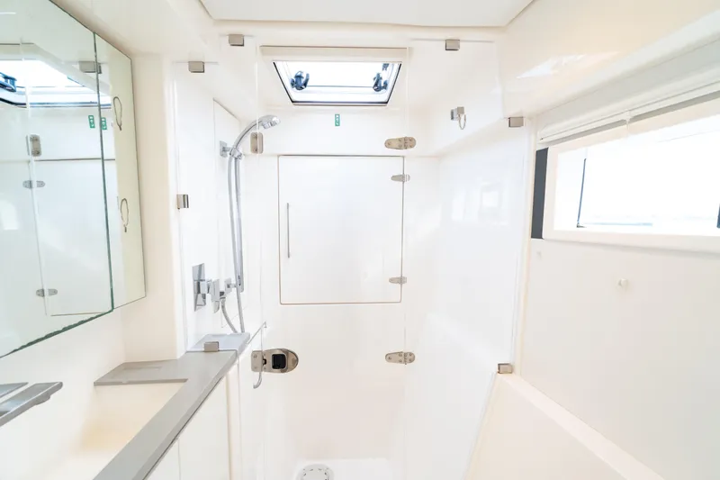 Everything Zen Yacht Photos Pics Modern bathroom interior of 2017 Leopard 40 yacht with shower and mirror.