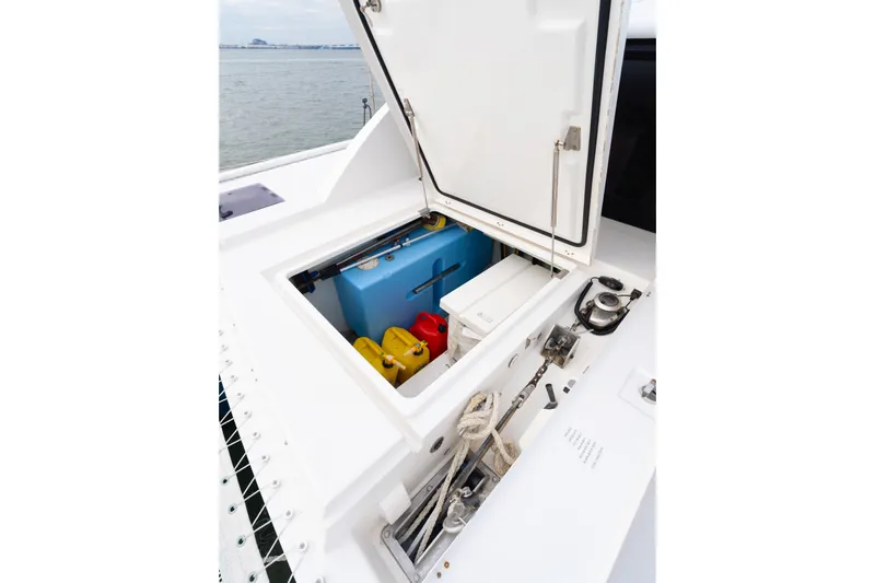 Everything Zen Yacht Photos Pics Open storage compartment on 2017 Leopard 40 catamaran, featuring ropes and containers.