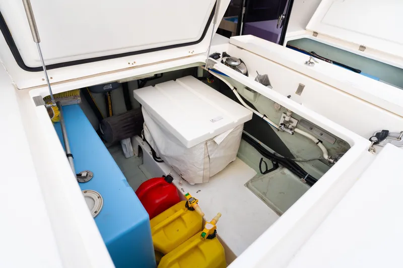 Everything Zen Yacht Photos Pics Storage compartment of a 2017 Leopard 40 catamaran with fuel containers and equipment.