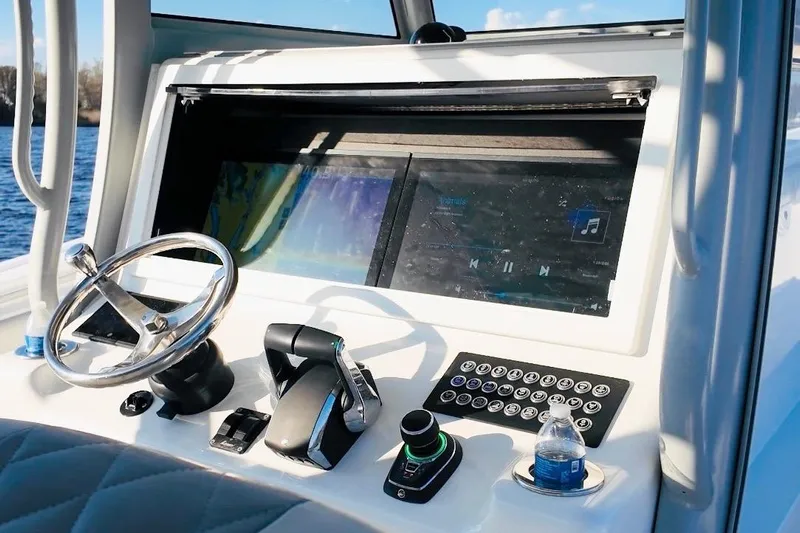  Yacht Photos Pics Helm of 2025 Onslow Bay 41 Tournament boat with modern controls and touchscreen display.