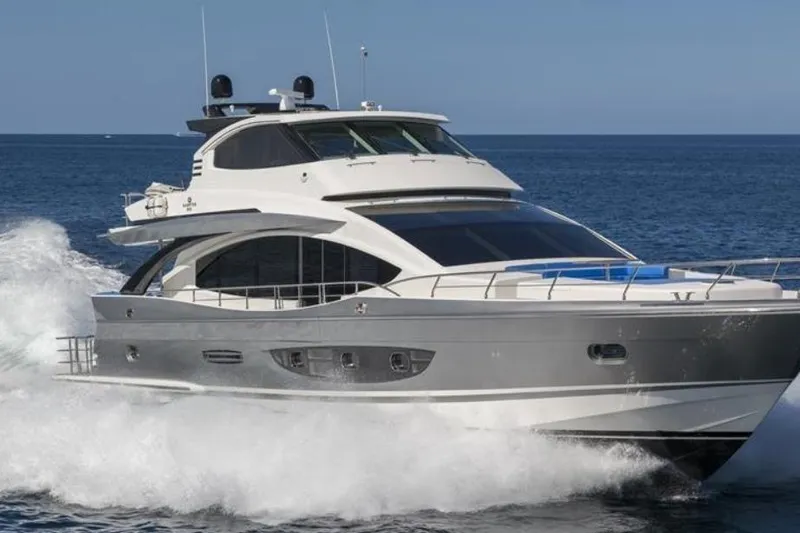  Yacht Photos Pics Luxurious 2014 Hampton Fly yacht cruising on open sea, showcasing sleek design and elegance.