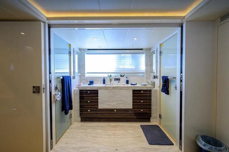  Yacht Photos Pics Luxurious yacht bathroom with modern fixtures, marble accents, and ambient lighting, Hampton Fly 2014 model.