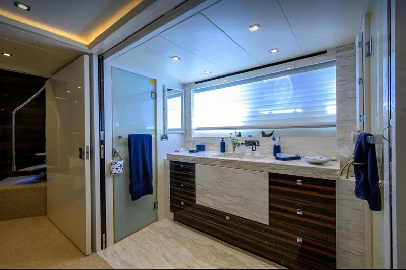  Yacht Photos Pics Luxurious yacht bathroom with modern fixtures, marble countertop, and ambient lighting, Hampton Fly 2014 model.