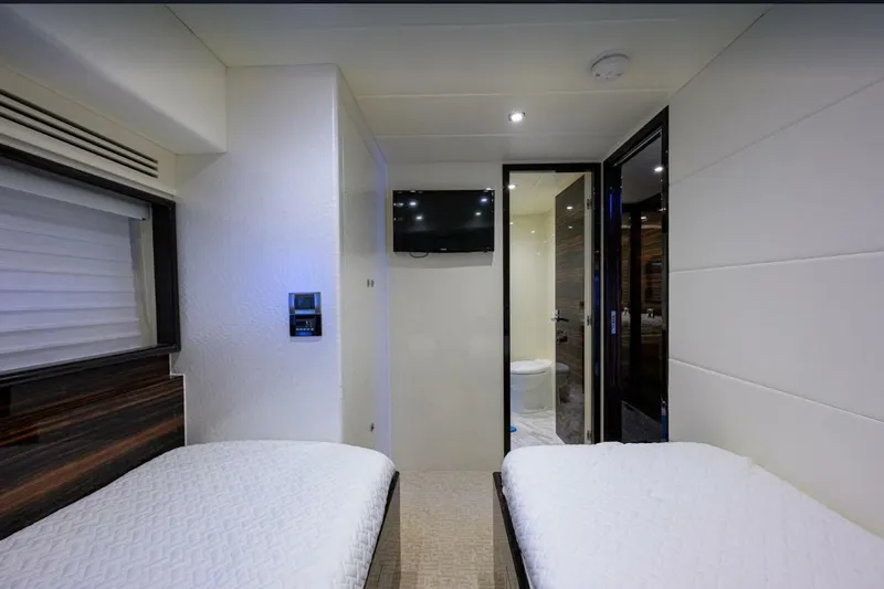  Yacht Photos Pics Interior of 2014 Hampton Fly yacht with twin beds and modern decor.