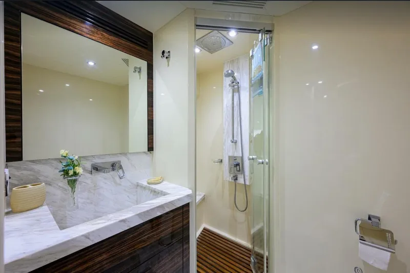  Yacht Photos Pics Luxurious bathroom in 2014 Hampton Fly yacht with marble sink and glass shower.