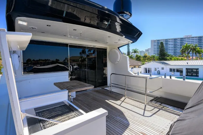  Yacht Photos Pics 2014 Hampton Fly yacht deck with modern design and cityscape view.
