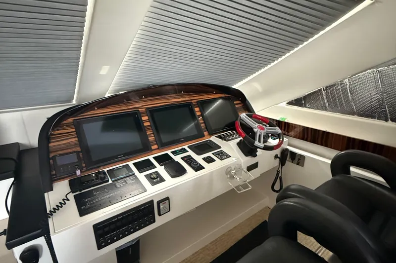  Yacht Photos Pics Control panel of a 2014 Hampton Fly yacht with modern navigation screens.