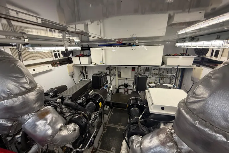  Yacht Photos Pics Engine room of a 2014 Hampton Fly yacht, showcasing machinery and equipment.