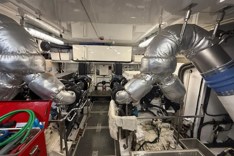  Yacht Photos Pics Engine room of a 2014 Hampton Fly yacht with insulated pipes and machinery.