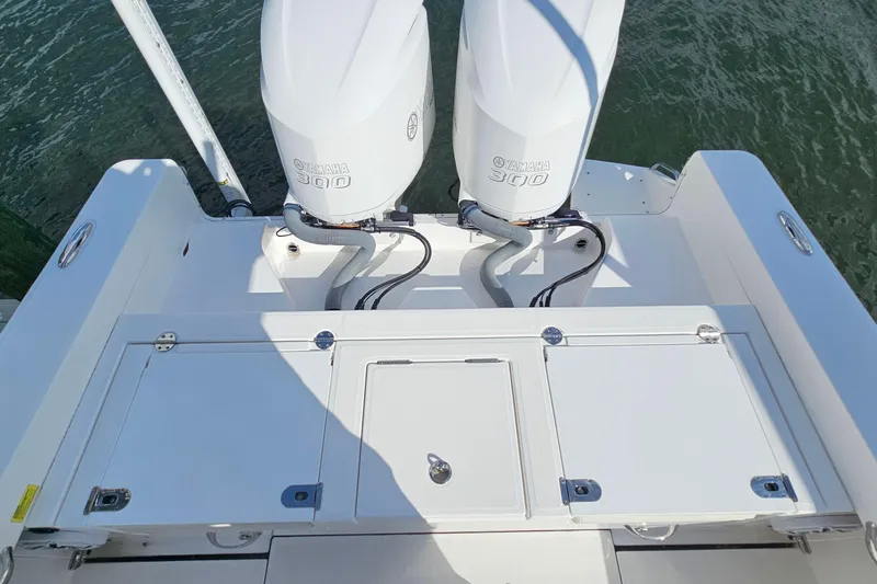  Yacht Photos Pics 2021 Everglades 273 Center Console with twin Yamaha 300 engines on water.