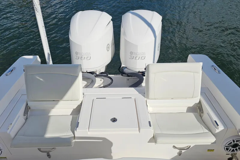  Yacht Photos Pics 2021 Everglades 273 Center Console with twin Yamaha 300 engines and white seating.
