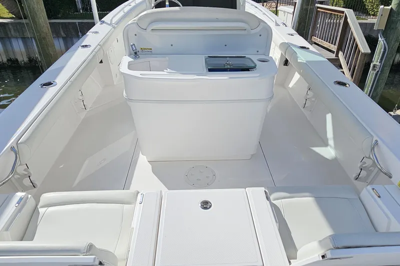  Yacht Photos Pics 2021 Everglades 273 Center Console boat interior with seating and storage.