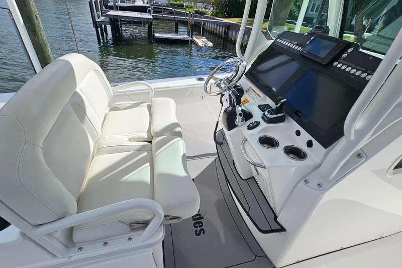  Yacht Photos Pics 2021 Everglades 273 Center Console boat interior with helm and seating.