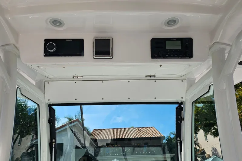  Yacht Photos Pics 2021 Everglades 273 Center Console interior with electronic controls and clear view.