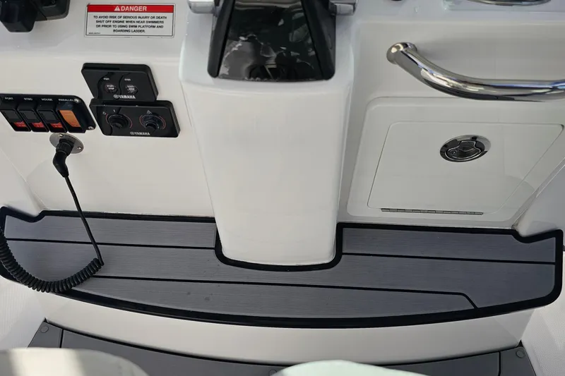  Yacht Photos Pics 2021 Everglades 273 Center Console boat dashboard with controls and warning label.