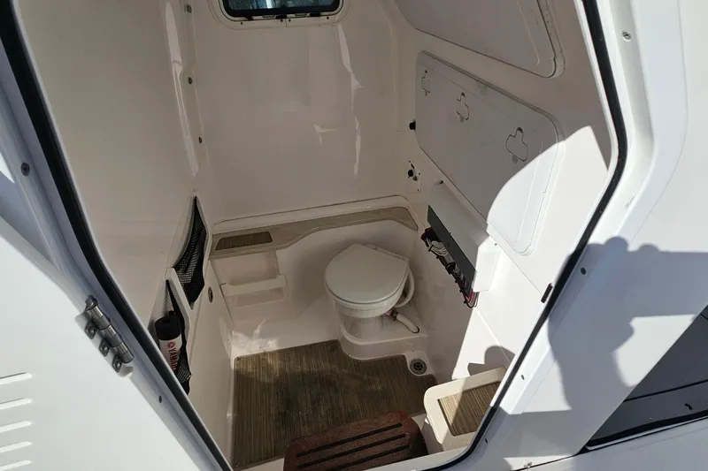 Yacht Photos Pics Interior of 2021 Everglades 273 Center Console boat with compact marine toilet.