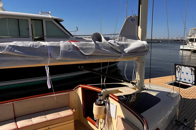  Yacht Photos Pics 2022 Leonardo Yachts Eagle 44 sailboat docked, featuring sleek design and covered sail.