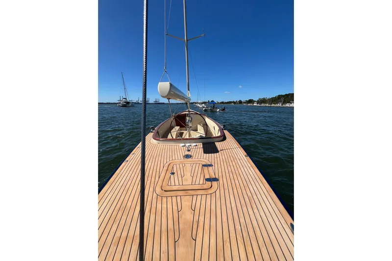  Yacht Photos Pics 2022 Leonardo Yachts Eagle 44 sailboat on calm water, featuring sleek wooden deck design.