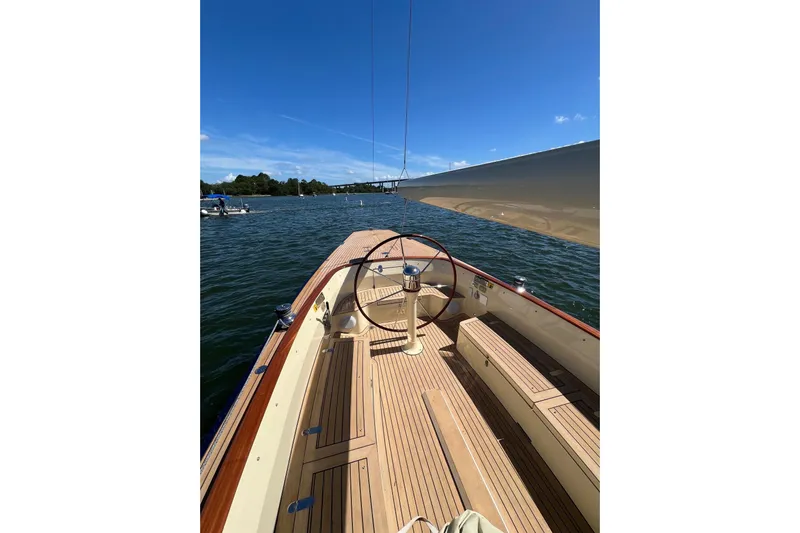  Yacht Photos Pics 2022 Leonardo Yachts Eagle 44 sailboat on calm water, featuring elegant wooden deck.