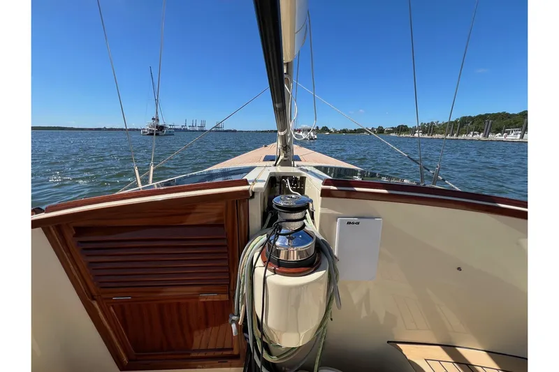  Yacht Photos Pics 2022 Leonardo Yachts Eagle 44 sailboat on calm waters, clear sky, marina view.