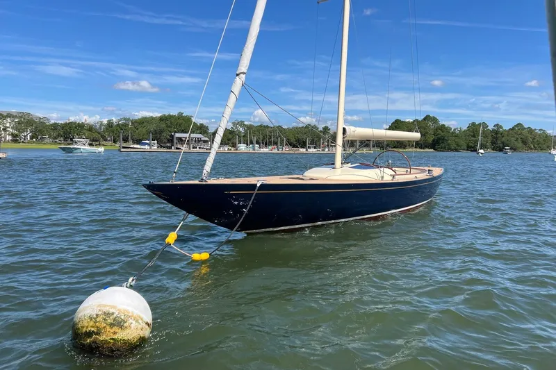  Yacht Photos Pics 2022 Leonardo Yachts Eagle 44 sailboat moored on calm water under blue sky.