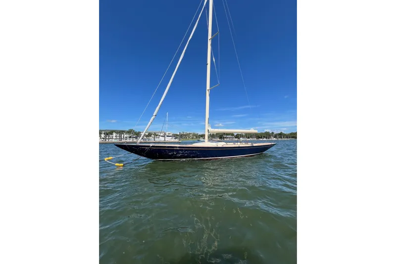  Yacht Photos Pics 2022 Leonardo Yachts Eagle 44 sailboat on calm water under clear blue sky.