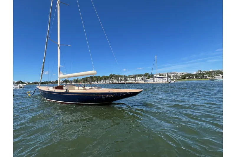  Yacht Photos Pics 2022 Leonardo Yachts Eagle 44 sailboat on calm water under clear blue sky.