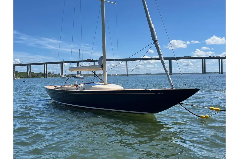  Yacht Photos Pics 2022 Leonardo Yachts Eagle 44 sailboat on water, with bridge in background.