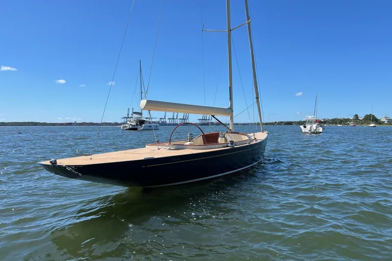  Yacht Photos Pics 2022 Leonardo Yachts Eagle 44 sailboat on calm water under clear blue sky.