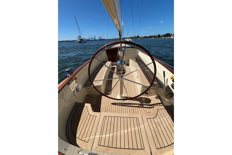  Yacht Photos Pics 2022 Leonardo Yachts Eagle 44 sailboat cockpit with wooden deck and steering wheel.
