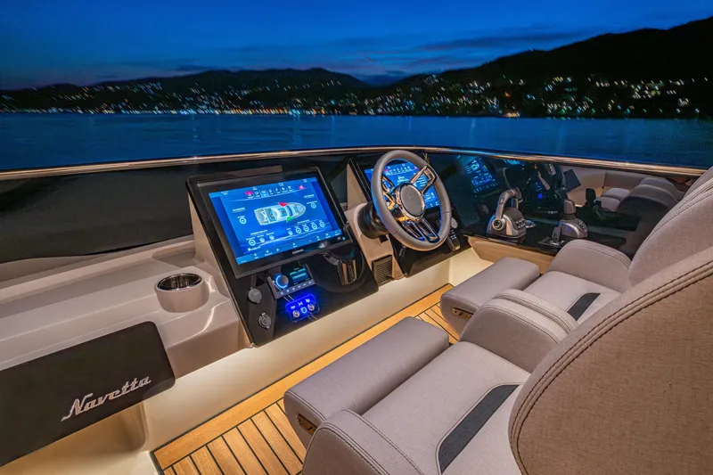The Absolute Vibe Yacht Photos Pics Luxurious 2026 Absolute Navetta 62 yacht cockpit with advanced navigation systems at dusk.