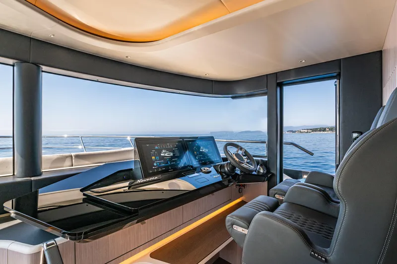 The Absolute Vibe Yacht Photos Pics Luxurious helm of 2026 Absolute Navetta 62 yacht with panoramic sea view.