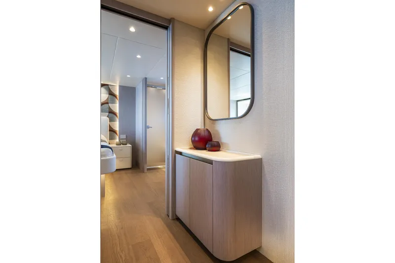 The Absolute Vibe Yacht Photos Pics Luxurious interior of 2026 Absolute Navetta 62 yacht with modern decor and elegant furnishings.