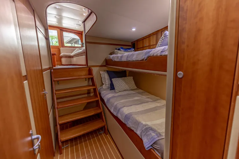 Honcho Yacht Photos Pics Interior of 2000 Custom Carolina Alex Willis Convertible with wooden bunk beds.
