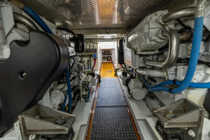 Honcho Yacht Photos Pics Engine room of 2000 Custom Carolina Alex Willis Convertible, showcasing machinery and components.