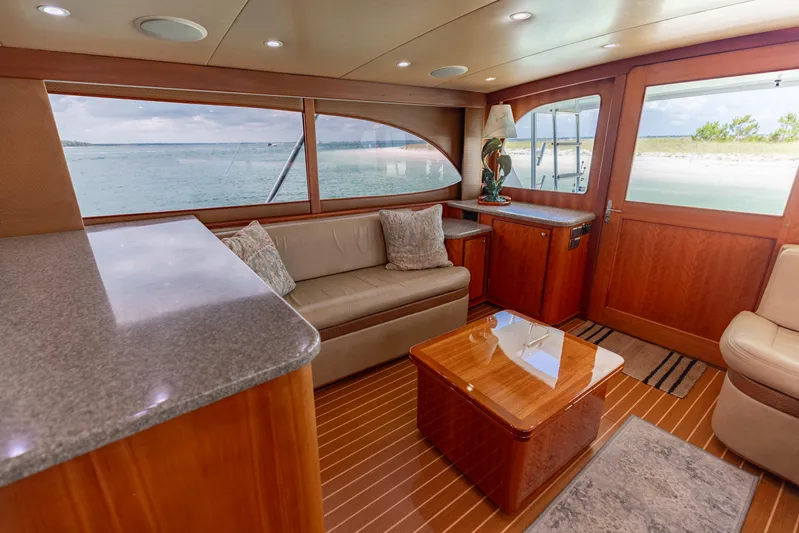 Honcho Yacht Photos Pics Luxurious interior of 2000 Custom Carolina Alex Willis Convertible yacht with ocean view.