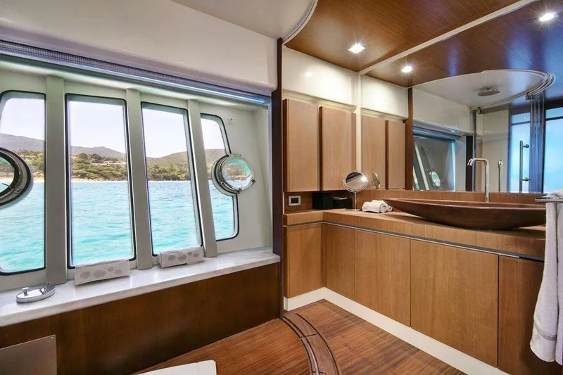 Yacht Photos Pics Luxurious bathroom interior of 2005 Ferretti 731 yacht with ocean view windows.