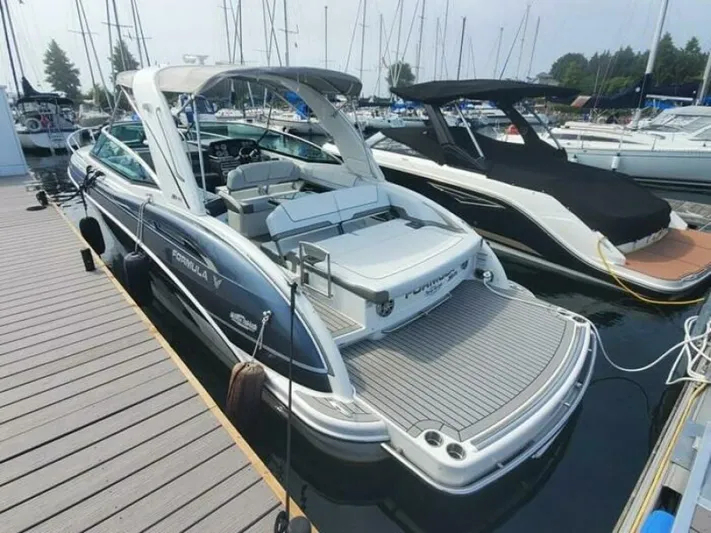  Yacht Photos Pics 2017 Formula 310SS boat docked at marina, featuring sleek design and spacious deck.