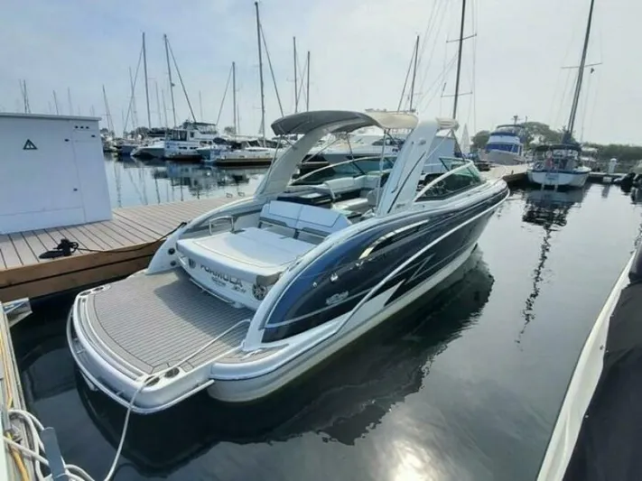  Yacht Photos Pics 2017 Formula 310SS boat docked at marina with sailboats in background.