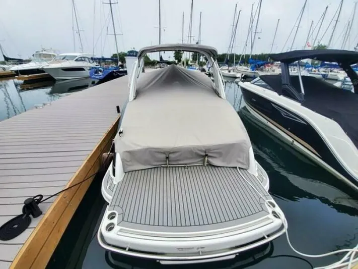  Yacht Photos Pics Covered 2017 Formula 310SS boat docked at marina with other vessels.