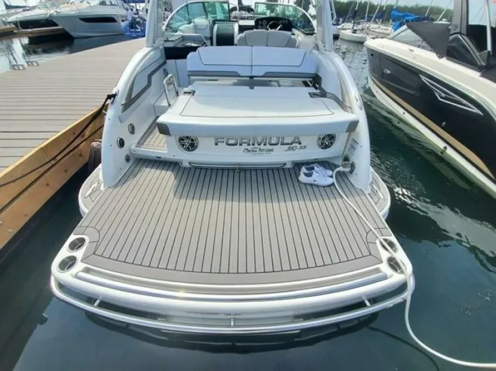  Yacht Photos Pics 2017 Formula 310SS boat docked, featuring spacious deck and sleek design.