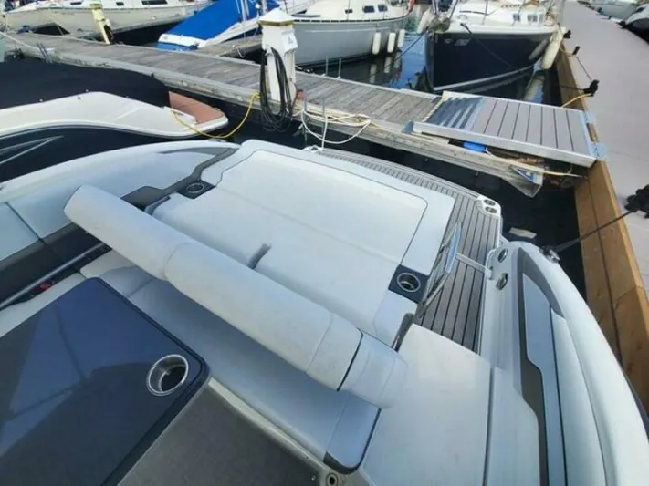  Yacht Photos Pics 2017 Formula 310SS boat at marina dock, featuring spacious deck and seating area.
