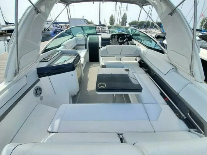 Yacht Photos Pics 2017 Formula 310SS boat interior with white seating and modern dashboard.